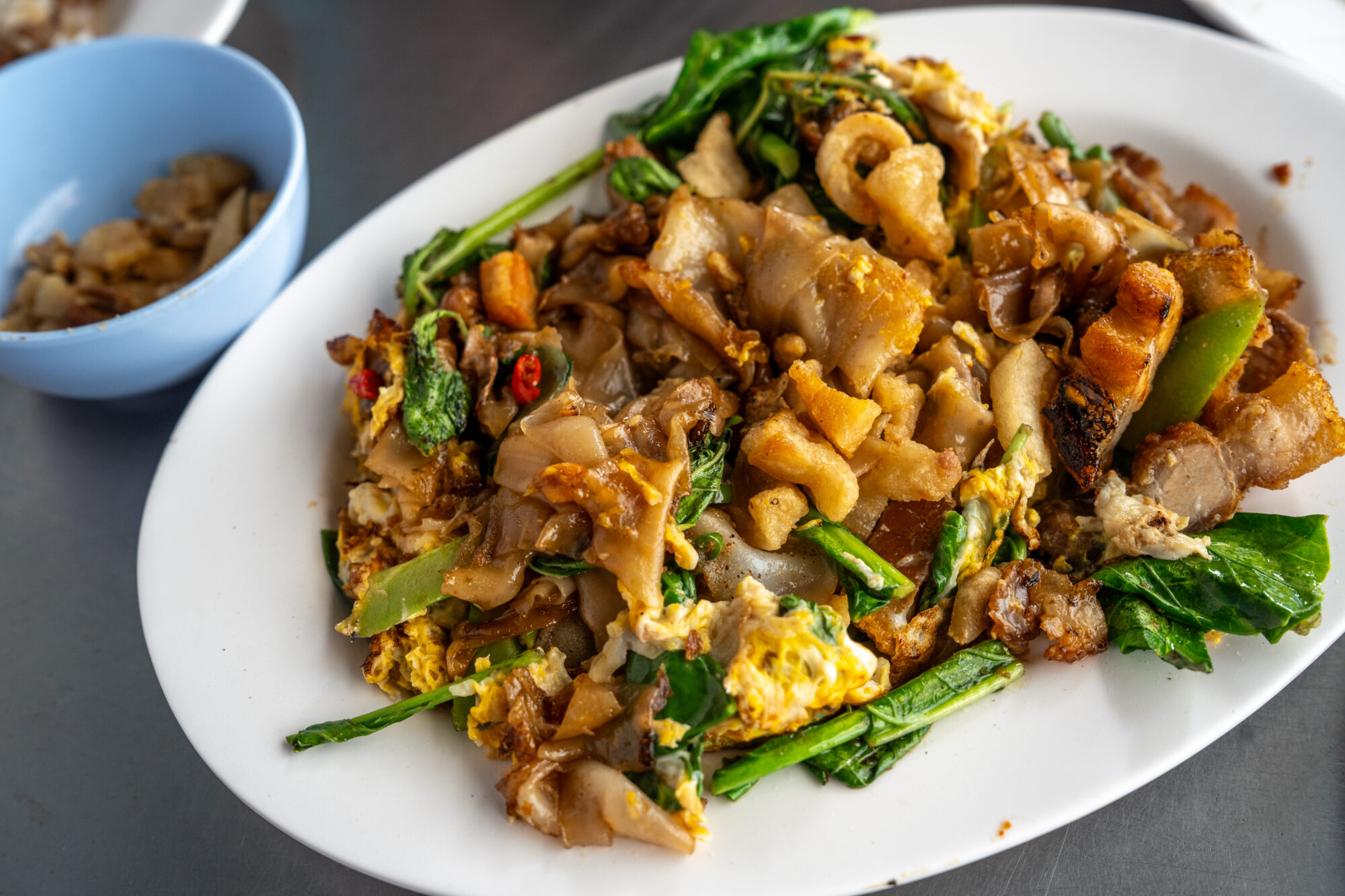 Drunken Noodles (Pad Kee Mao) ผัดขี้เมา - w/ Sen Yai (เส้นใหญ่) w/ moo krob